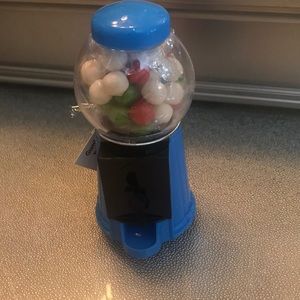 A mini gum ball machine ( five inch ) blue.